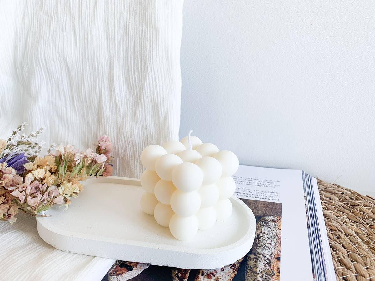Handmade Bubble Soy Candle in white wax displayed as modern home décor.